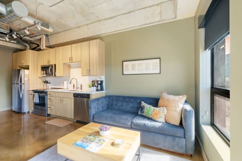 Cozy modern apartment with kitchen and living space.