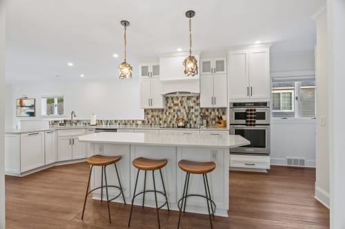 Your dream kitchen awaits with pristine white cabinets, stylish pendant lighting, and a spacious island for cooking adventures.