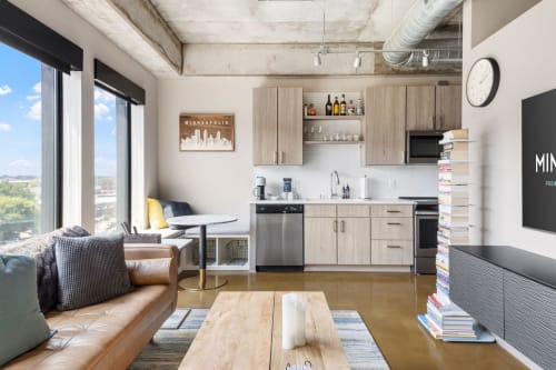 Your stylish loft features exposed beams, a fully equipped kitchen, and city views that make every moment memorable.