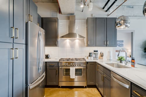 Step into your gourmet kitchen featuring sleek cabinetry, professional-grade appliances, and pristine countertops for memorable meal preparation.