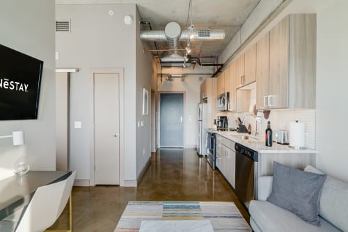 Step into your sleek modern retreat with open-plan living, fully equipped kitchen, and industrial chic details that create the perfect urban escape.