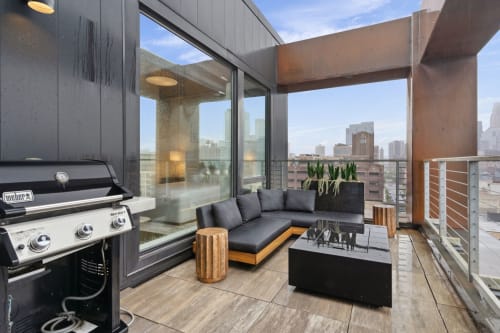 Grill up dinner while soaking in stunning city skyline views from your private covered terrace with stylish lounge seating.