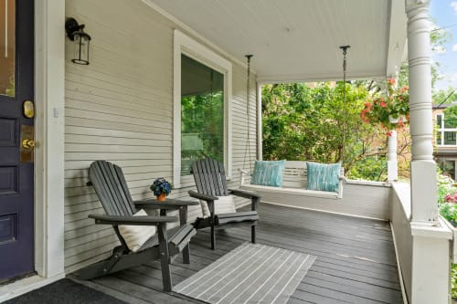 Settle into your private porch with Adirondack chairs and porch swing, where morning coffee tastes better surrounded by lush gardens.